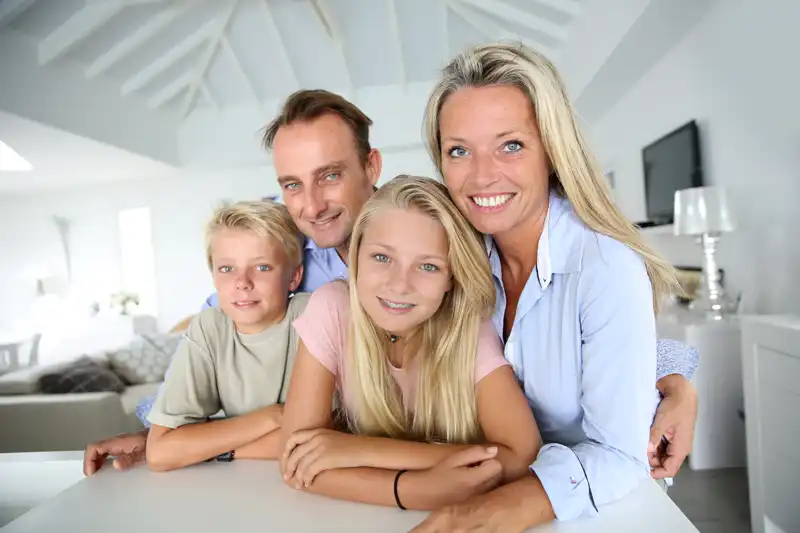 a happy family relaxing in a warm home